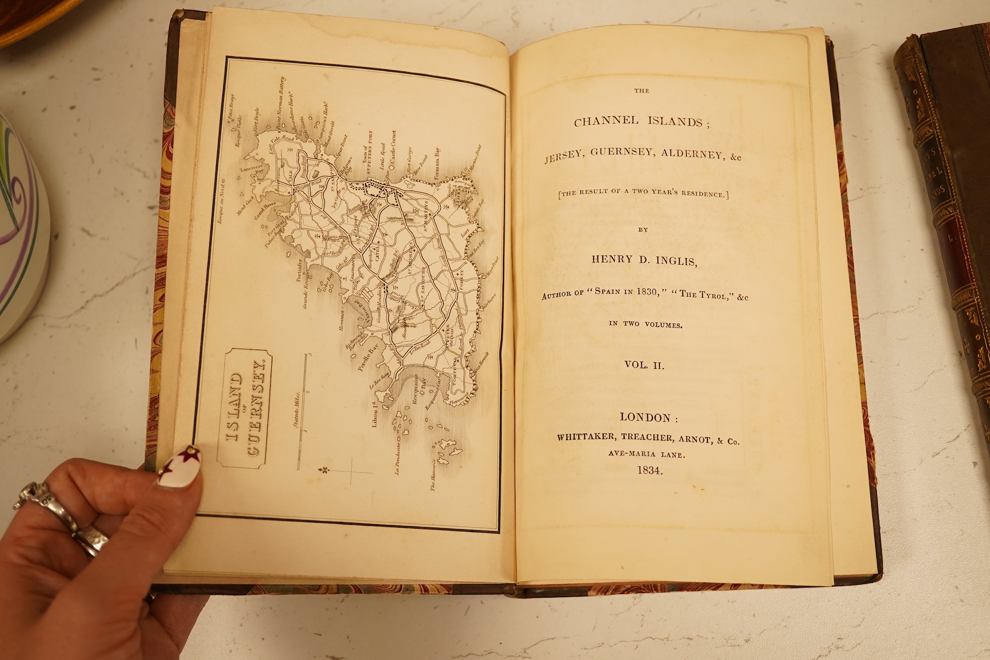 Inglis, Henry D. - The Channel Islands ... [the result of two year's residence]. 2 vols. 2 maps; old half calf and marbled boards, gilt decorated and panelled spines, sm.8vo. 1834